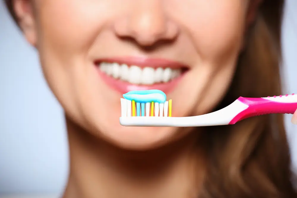 Woman brushing teeth