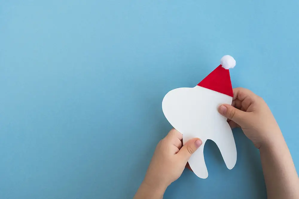 Tooth with a santa hat